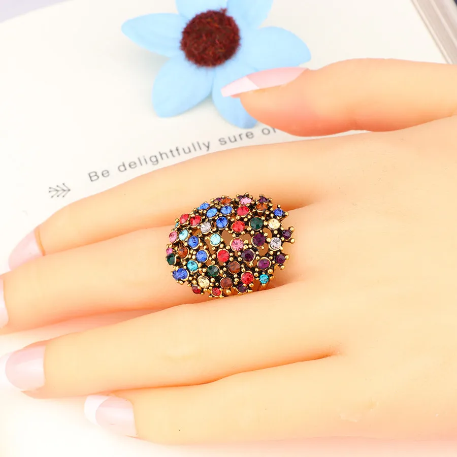 Dense four-prong black diamond ring